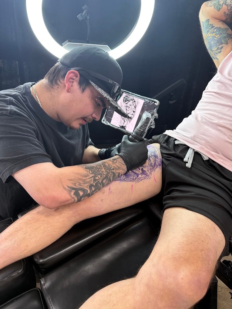 Tattoo artist at work in the Soul Stone Tattoo studio